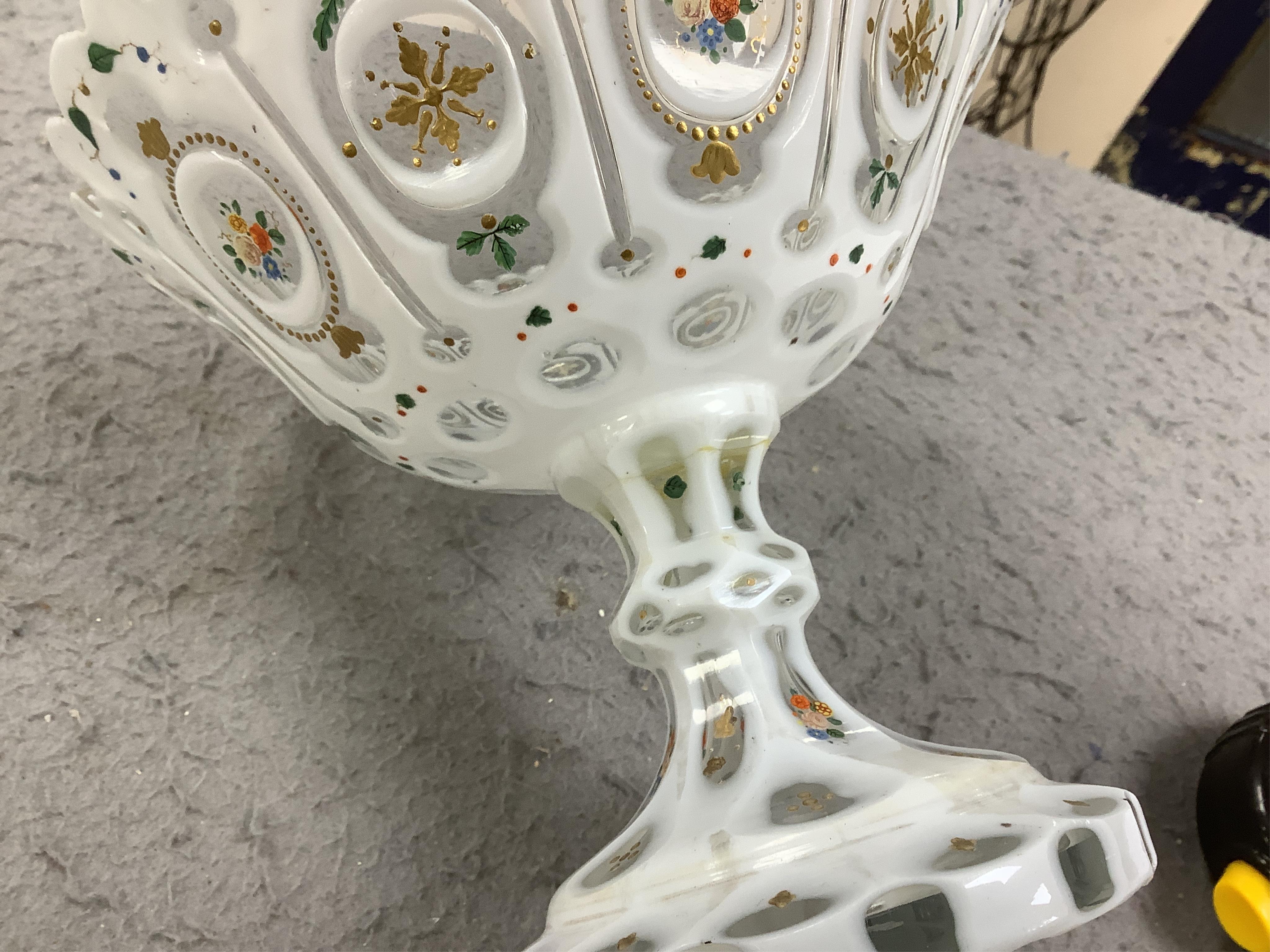 A pair of late 19th century Bohemian enamelled overlaid glass vases, and a similar overlaid glass comport. Condition - vases fair; comport poor